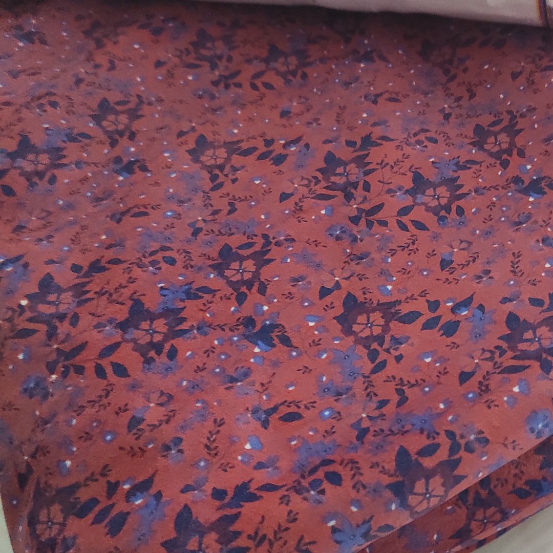 Velours fleurs bleues fond paprika