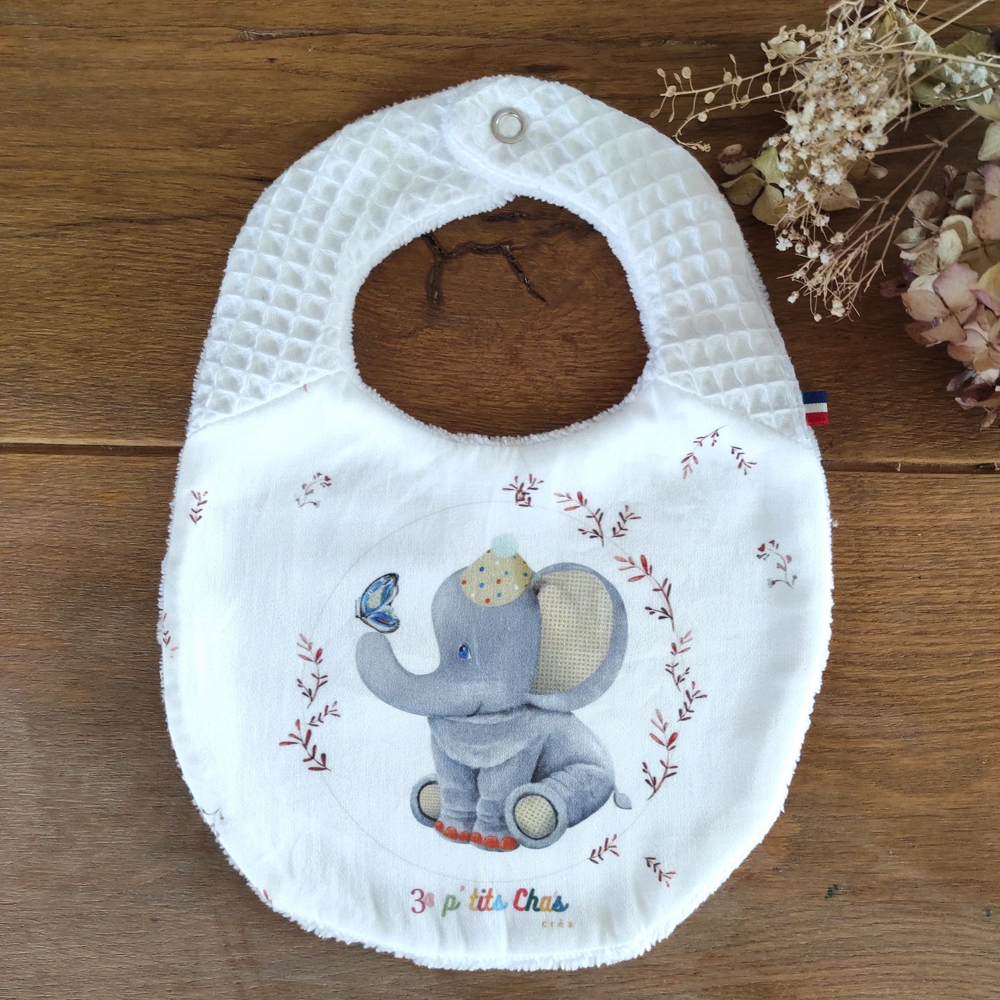 Bavoir éléphant- nid d'abeille blanc dans les bretelles